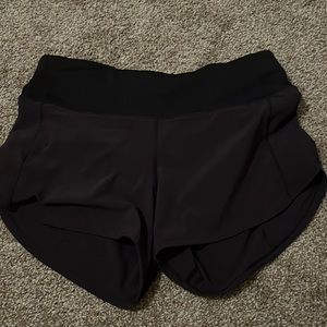 Black lululemon running shorts (mesh inside cut out)!(: